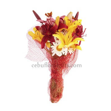 Heaven Scent - $45. Bouquet of yellow & red lilies accented with white gerbera.