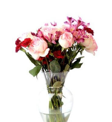 Majesty - $68. White & pink roses, red carnations presented in a glass vase.